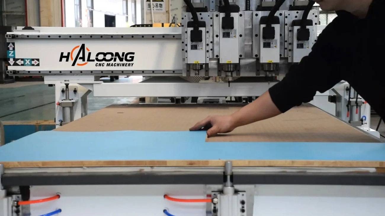 Place the OSB raw materials to be processed on the vacuum adsorption workbench of the Haloong CNC router